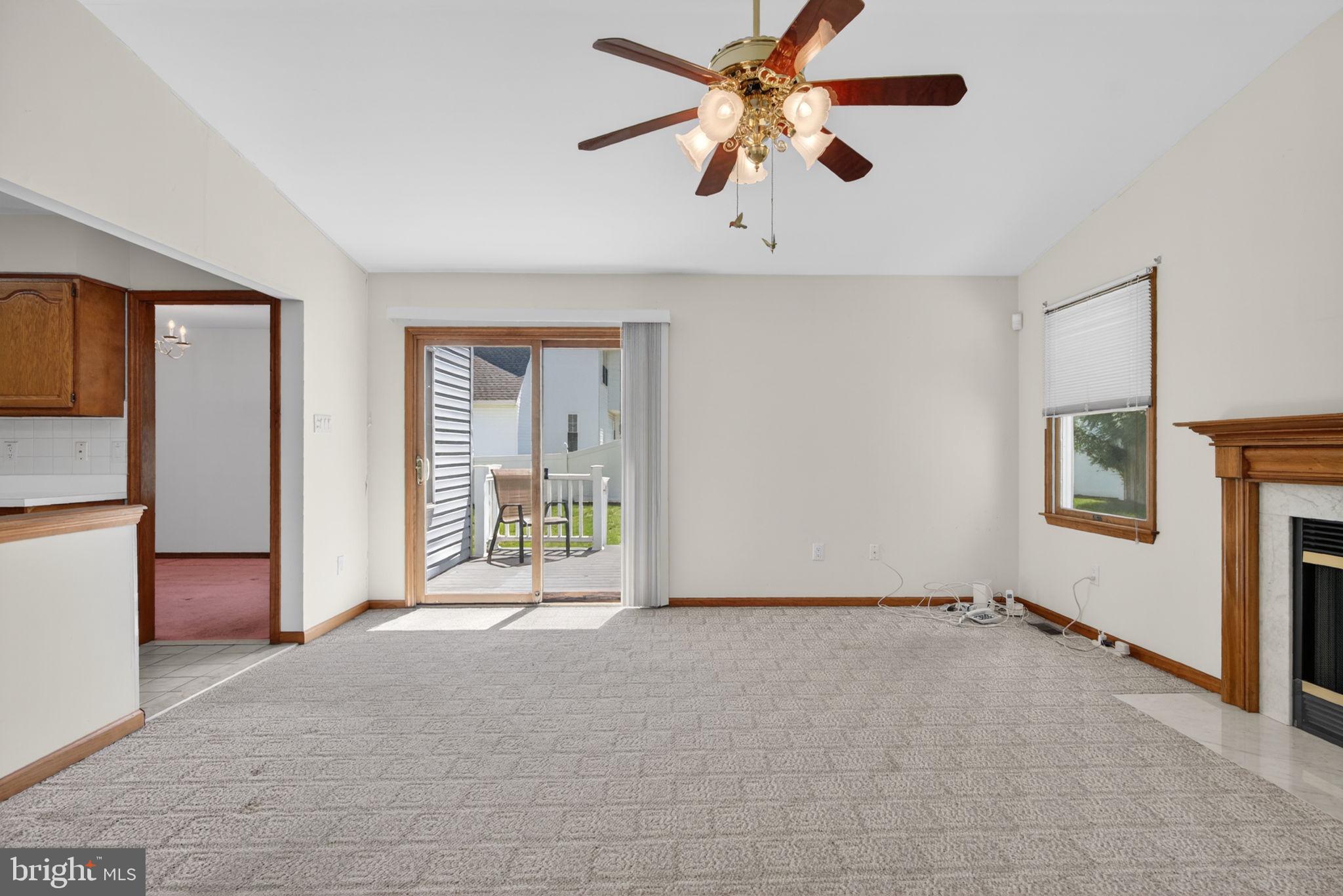 504 Ash Street Glassboro, NJ 08028 - Photo 17 of 42 a view of a livingroom with a ceiling fan and window