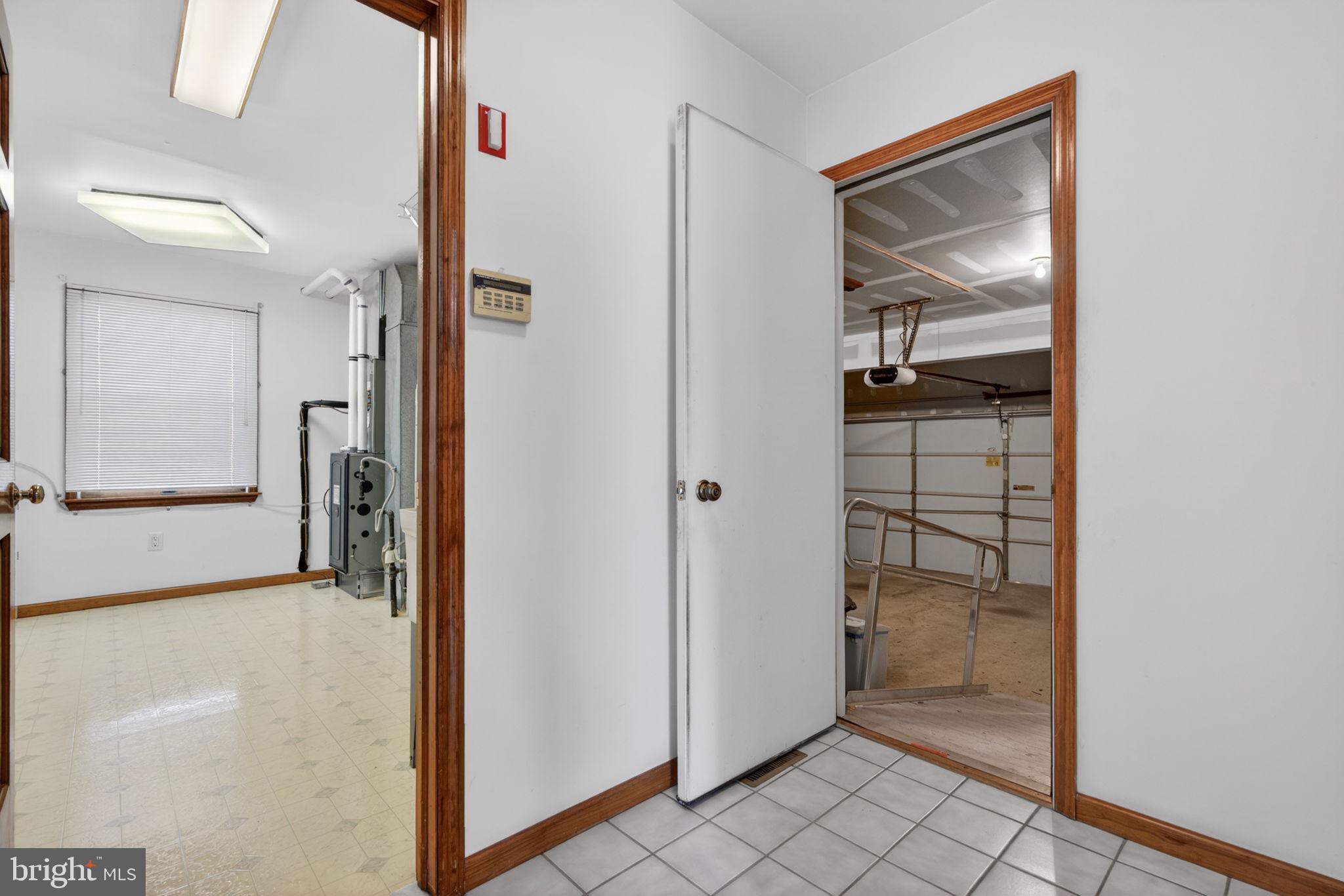 504 Ash Street Glassboro, NJ 08028 - Photo 19 of 42 a view of a hallway with wooden floor and closet