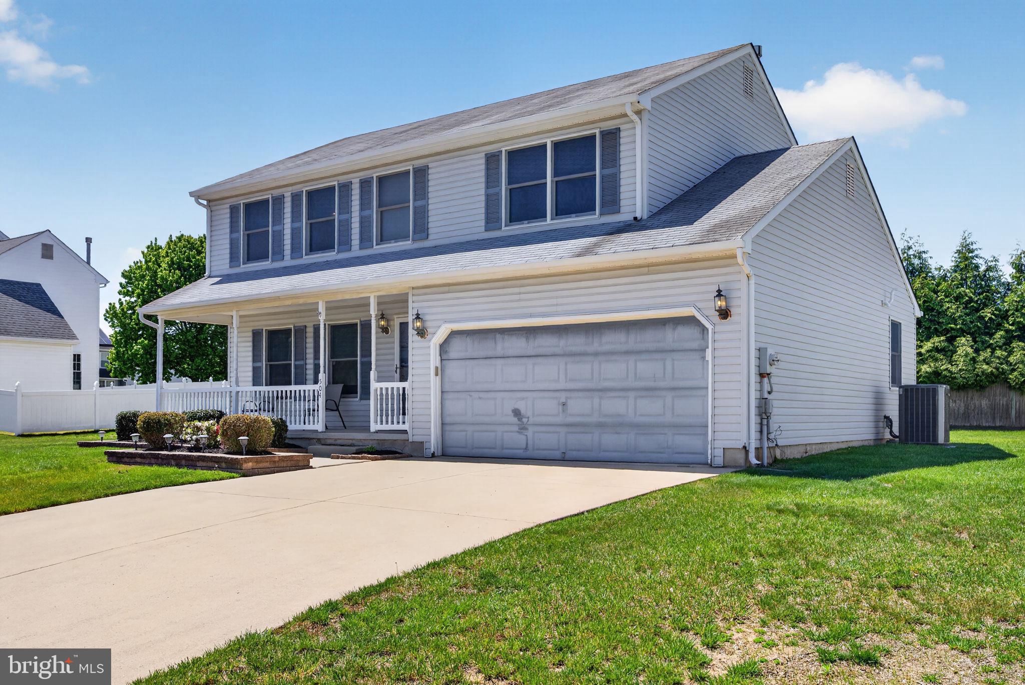 504 Ash Street Glassboro, NJ 08028 - Photo 2 of 42 a front view of a house with a yard and garage