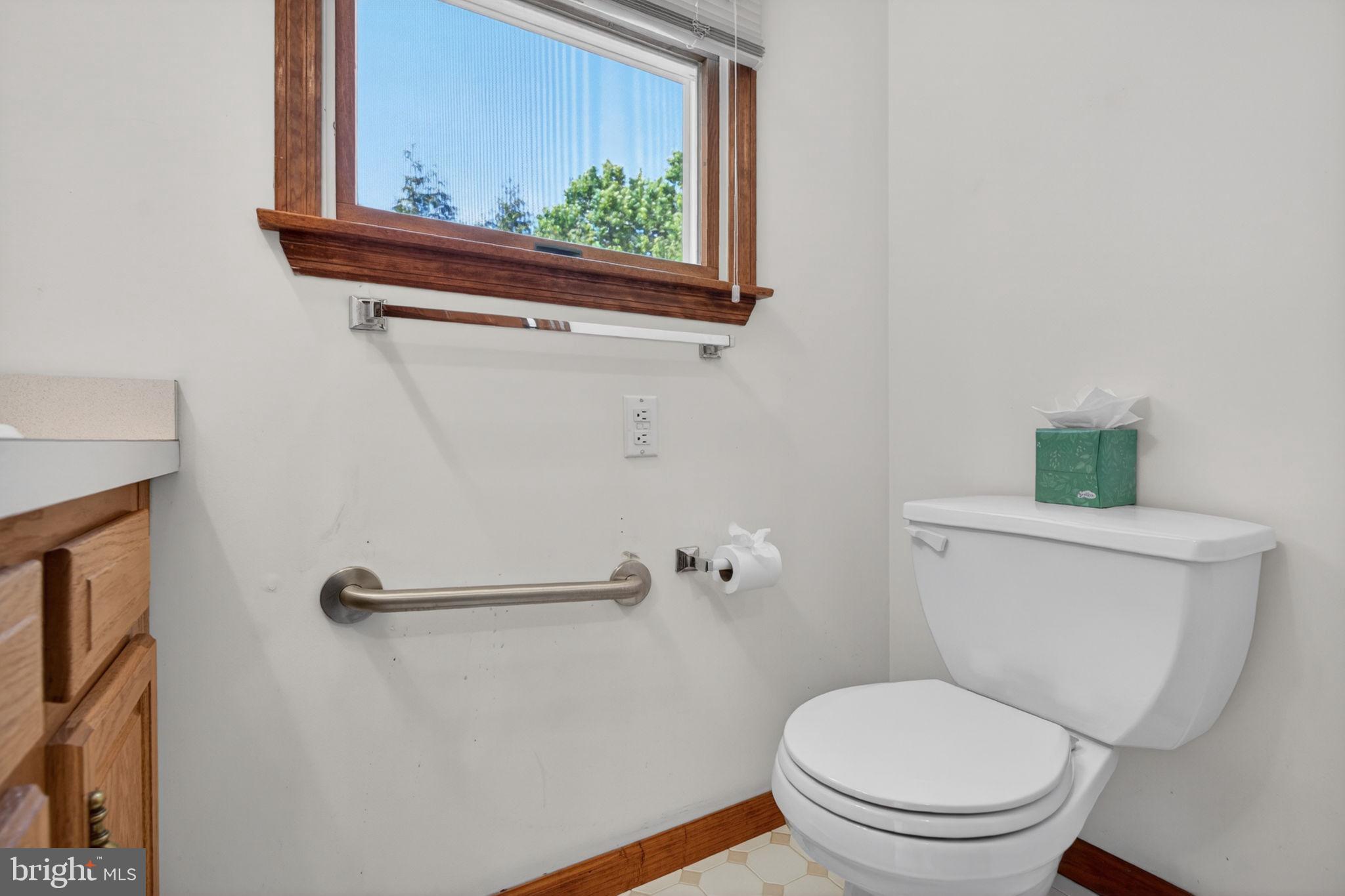 504 Ash Street Glassboro, NJ 08028 - Photo 21 of 42 a white toilet sitting next to a bathroom sink