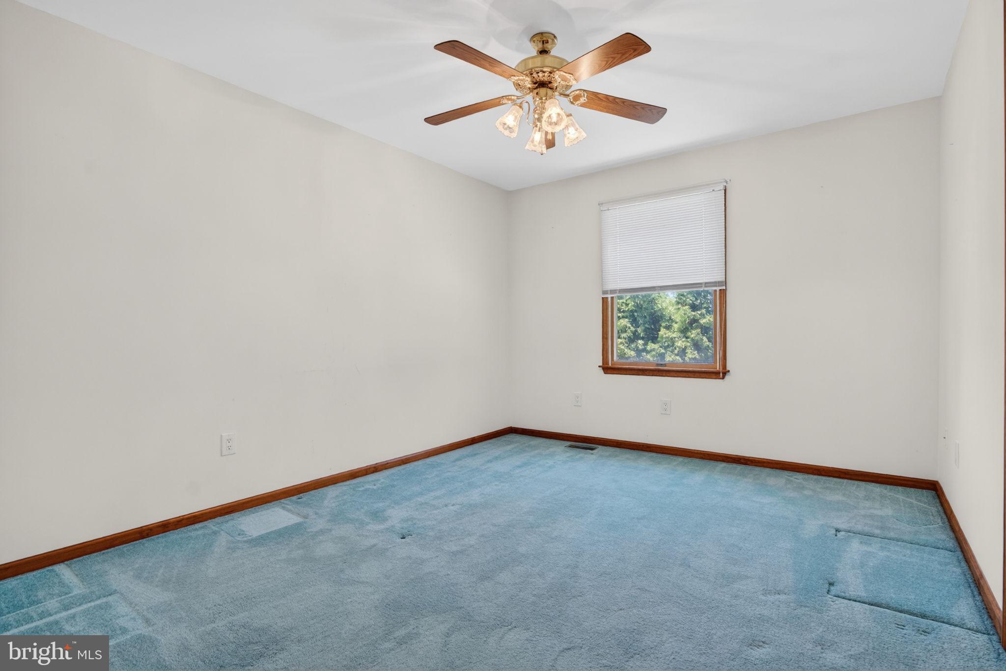 504 Ash Street Glassboro, NJ 08028 - Photo 30 of 42 an empty room with a window and a fan