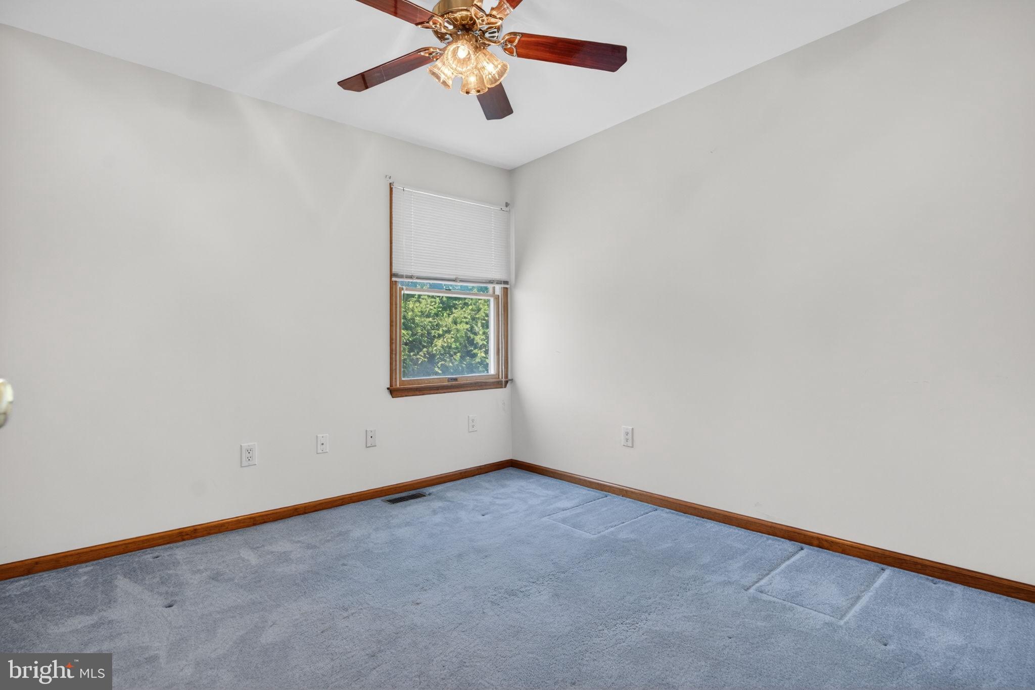 504 Ash Street Glassboro, NJ 08028 - Photo 32 of 42 an empty room with a window and a fan