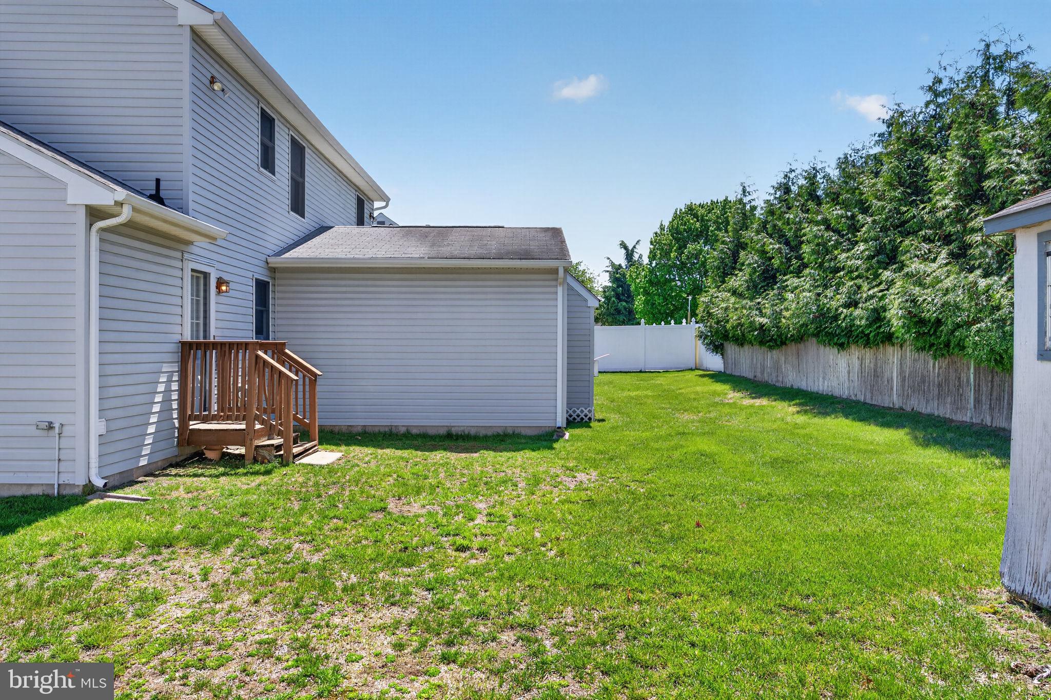 504 Ash Street Glassboro, NJ 08028 - Photo 34 of 42 a backyard of a house with lots of green space