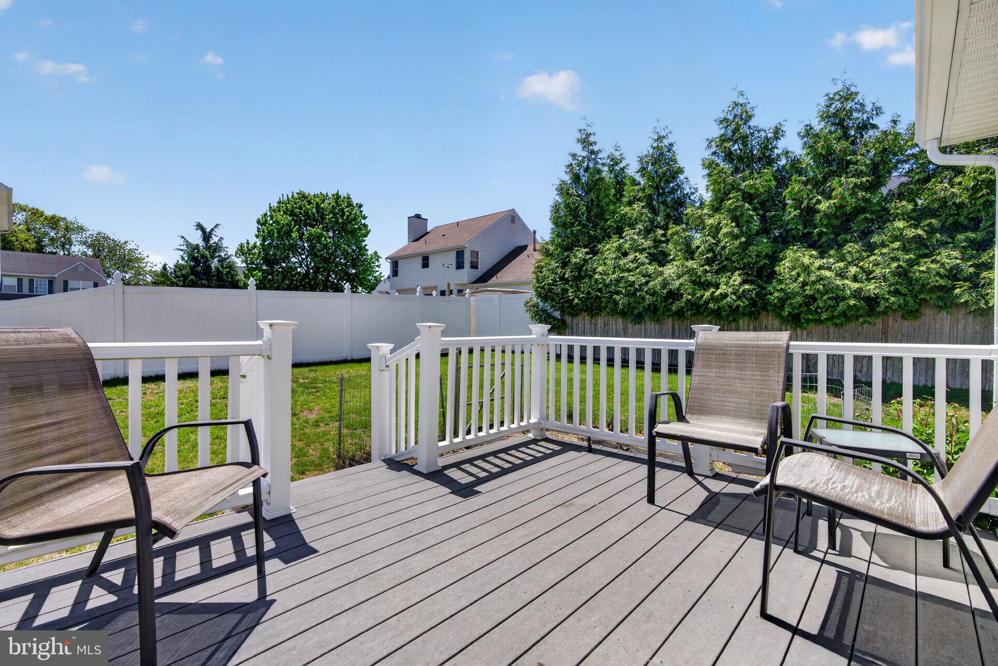 504 Ash Street Glassboro, NJ 08028 - Photo 37 of 42 a view of a chairs on wooden deck
