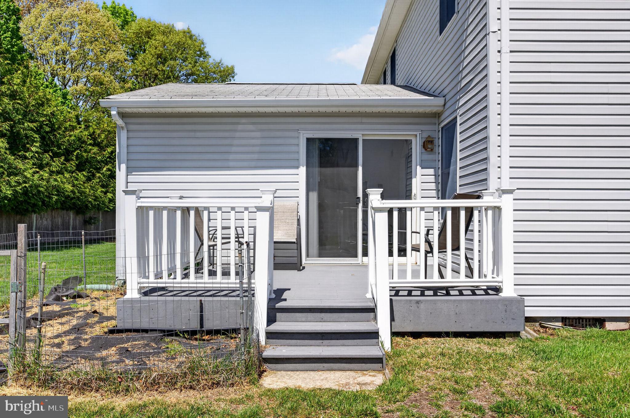 504 Ash Street Glassboro, NJ 08028 - Photo 38 of 42 a view of a house with a yard and furniture
