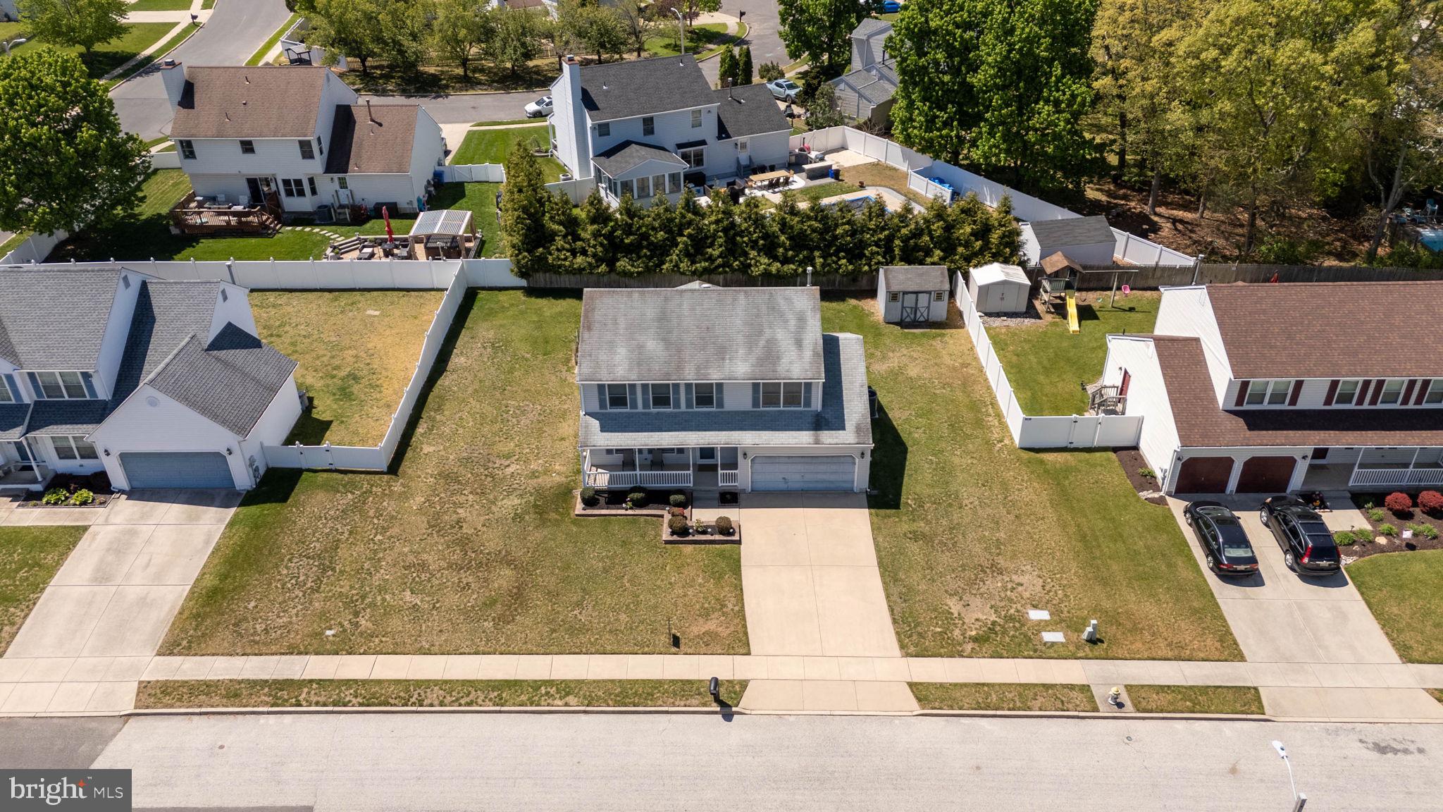 504 Ash Street Glassboro, NJ 08028 - Photo 39 of 42 an aerial view of a house with swimming pool and large trees