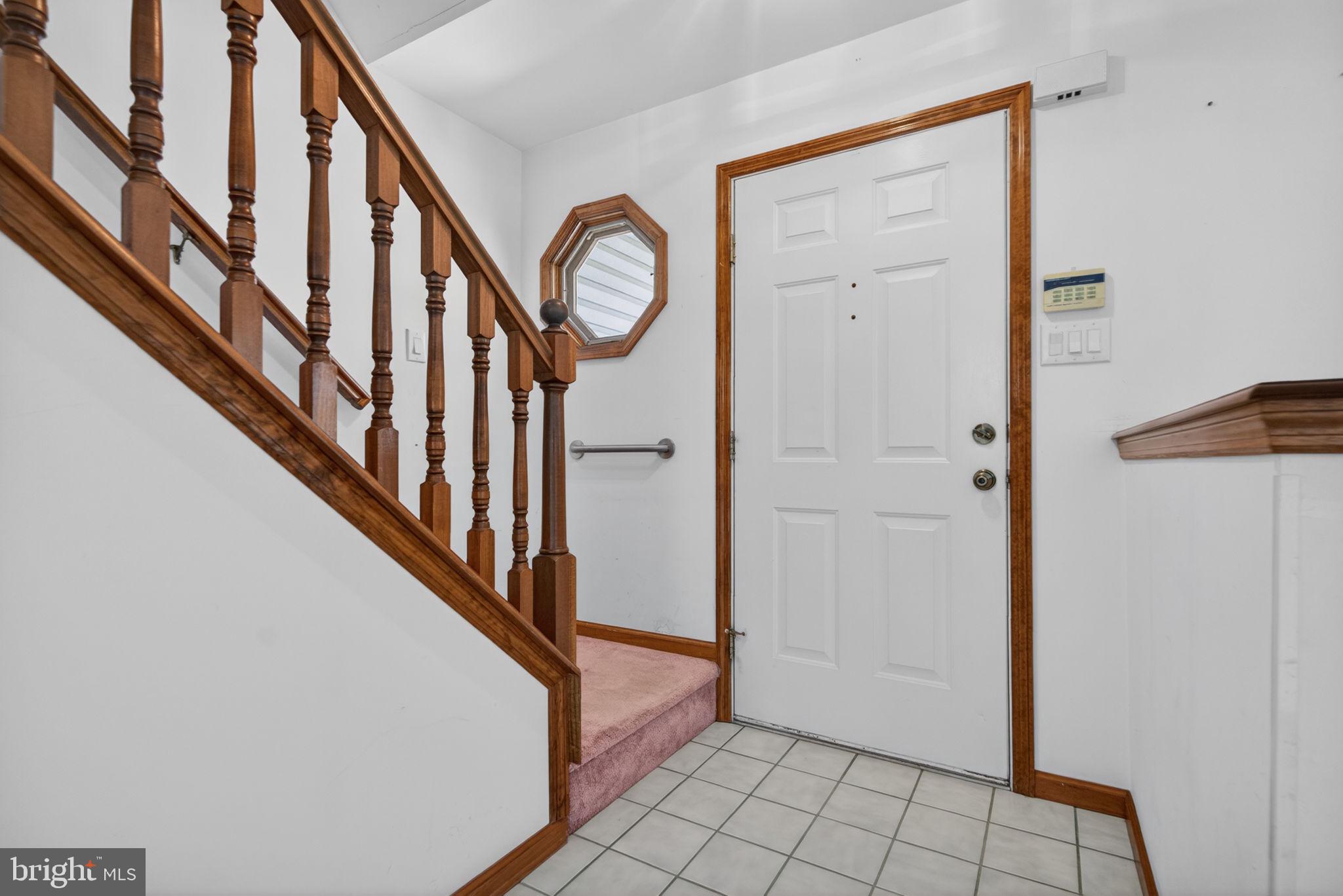 504 Ash Street Glassboro, NJ 08028 - Photo 5 of 42 a view of an entryway with staircase
