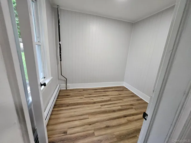a view of a room with wooden floor and staircase