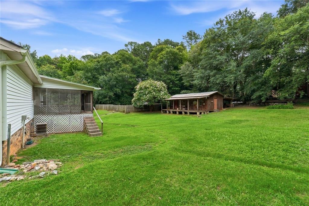 399 Donahoo Road Southeast Silver Creek, GA 30173 - Photo 18 of 22 a view of a house with backyard and sitting area