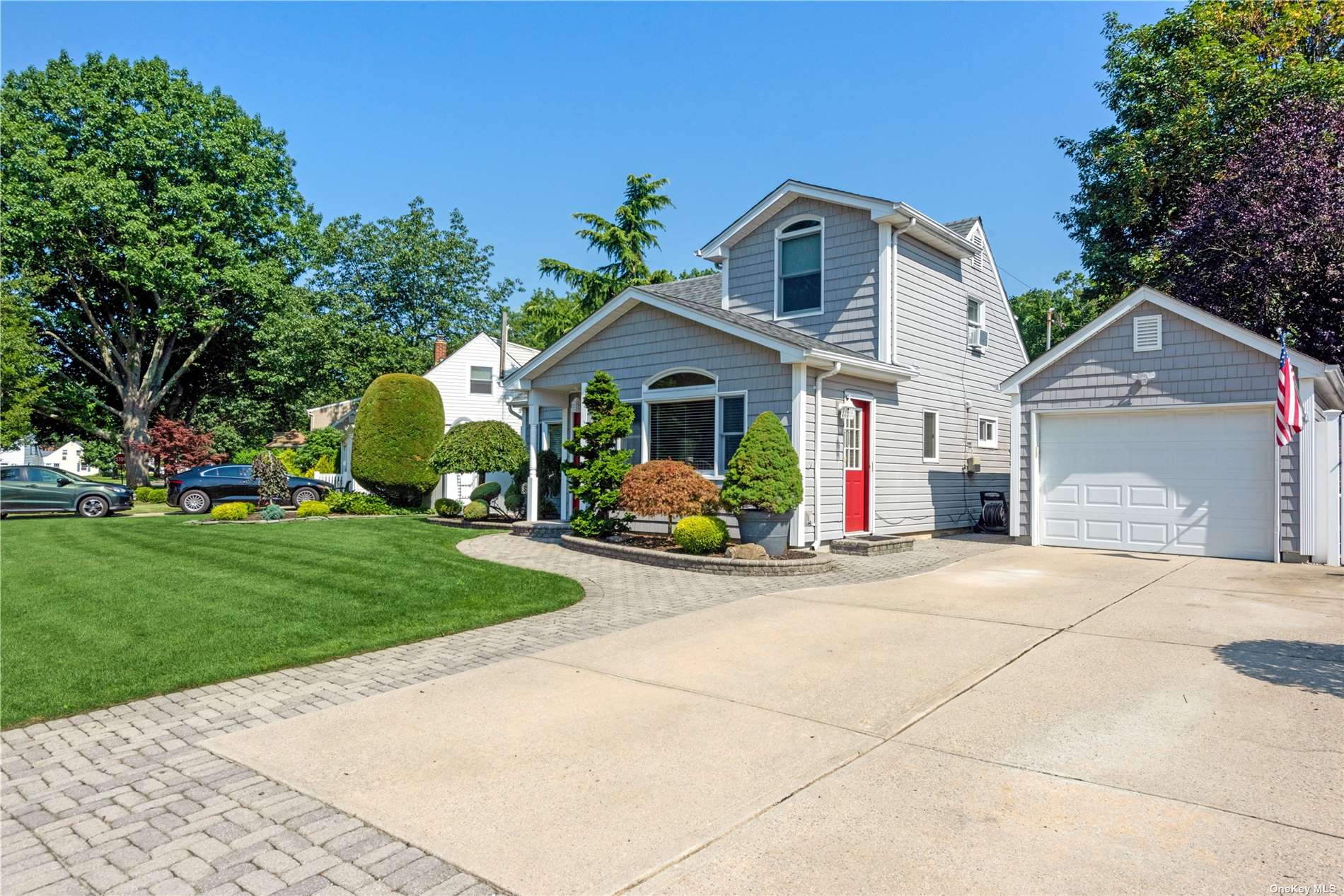 37 Azalea Road Levittown, NY 11756 - Photo 1 of 1 a front view of a house with garden and porch