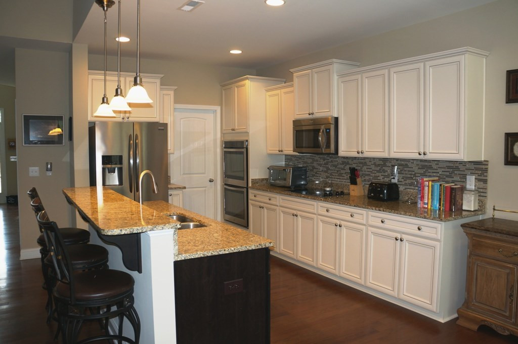 2316 Everstone Road Wake Forest, NC 27587 - Photo 7 of 25 Double Ovens, Huge walk in pantry, built in microwave, gorgeous granite.....this kitchen has it all! Chef's Kitchen