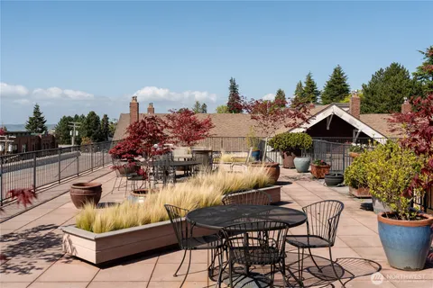 a view of a backyard with sitting area