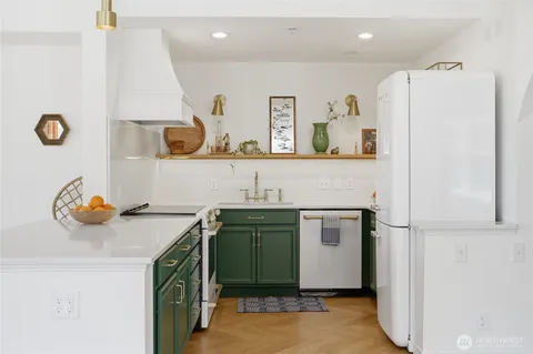 a utility room with sink dryer and washer