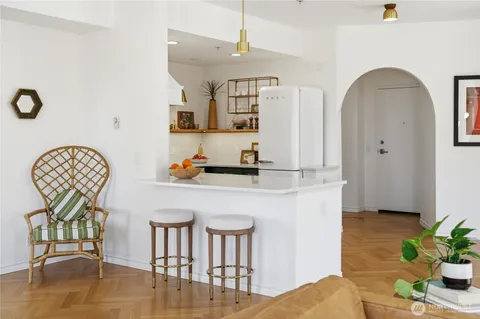 a living room with dining table