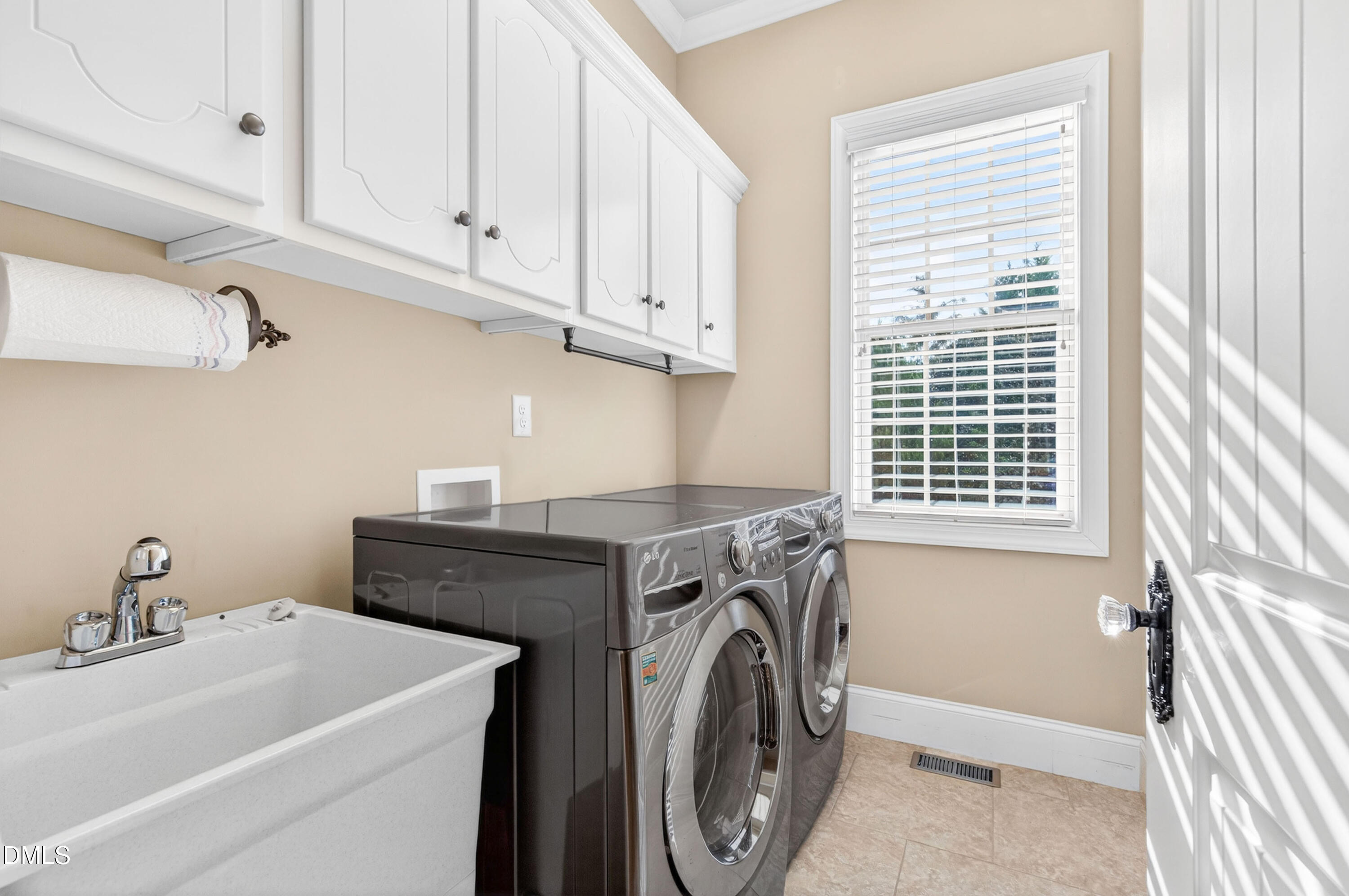 691 Hawthorne Place Creedmoor, NC 27522 - Photo 44 of 84 a utility room with dryer and washer