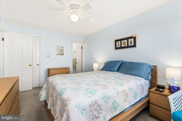 a bedroom with a bed and a chair