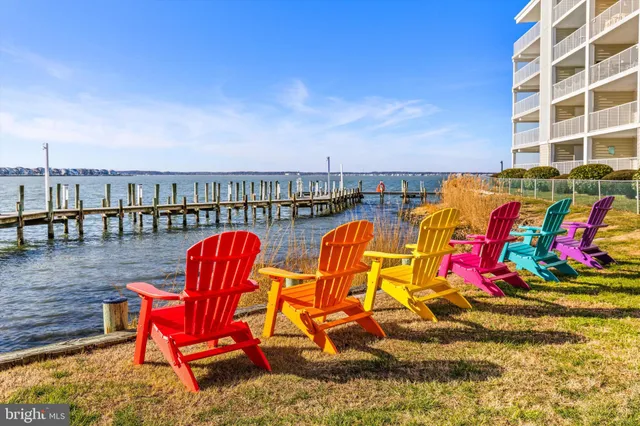 a view of swimming pool with sitting area