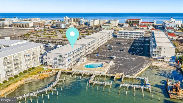 an aerial view of a house with a swimming pool