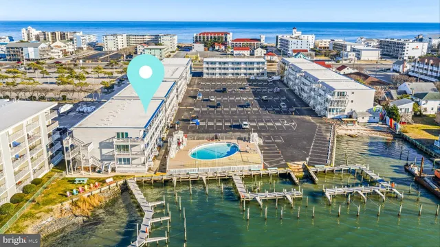 a view of a lake with a house next to a yard