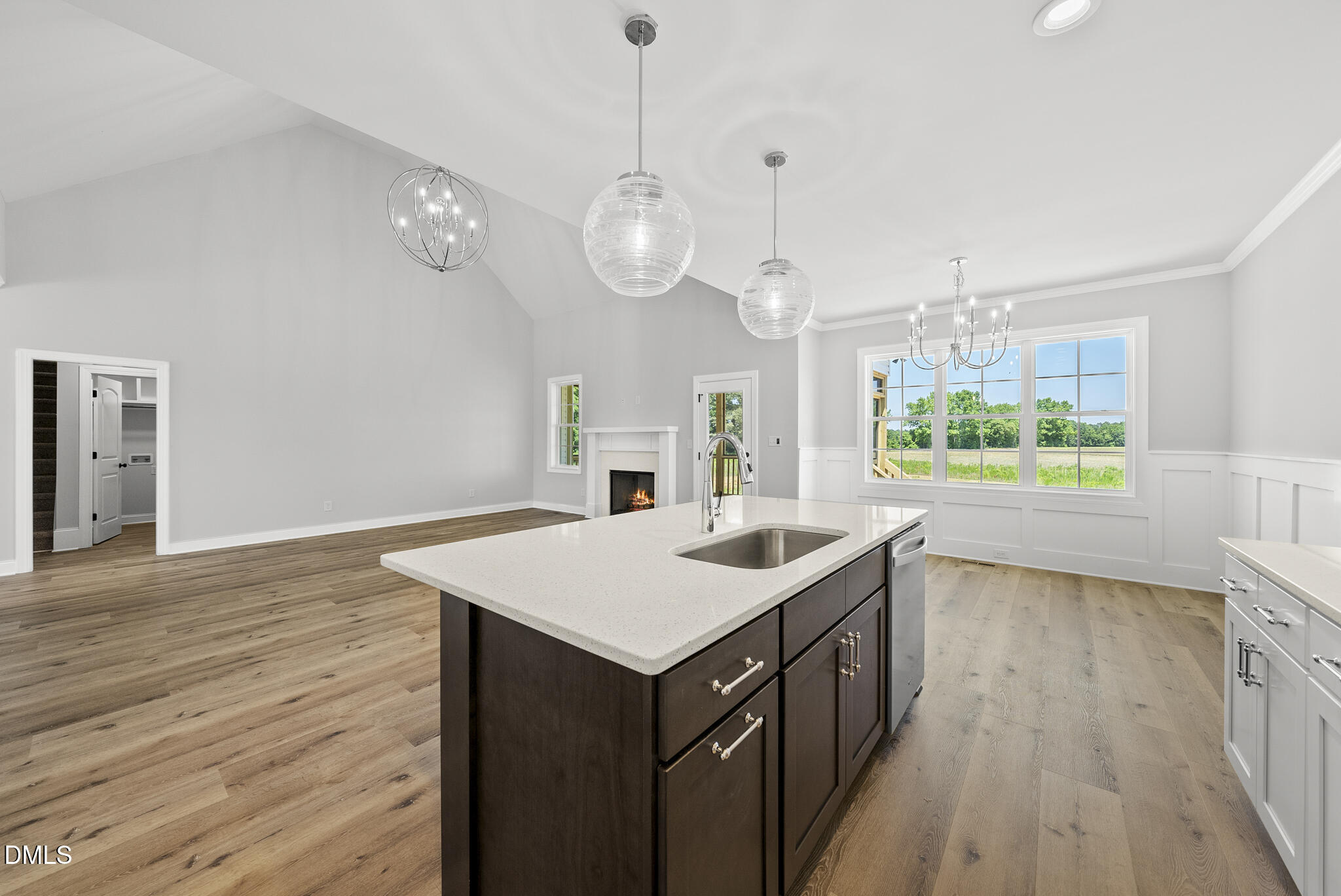 5377 River Buck Rd Spring Spring Hope, NC 27882 - Photo 13 of 34 a kitchen that has a kitchen island wooden floor and stainless steel appliances