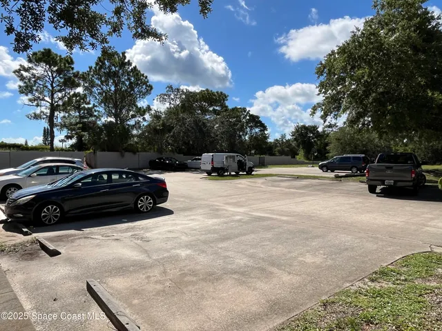 a view of a car parked in front of a house