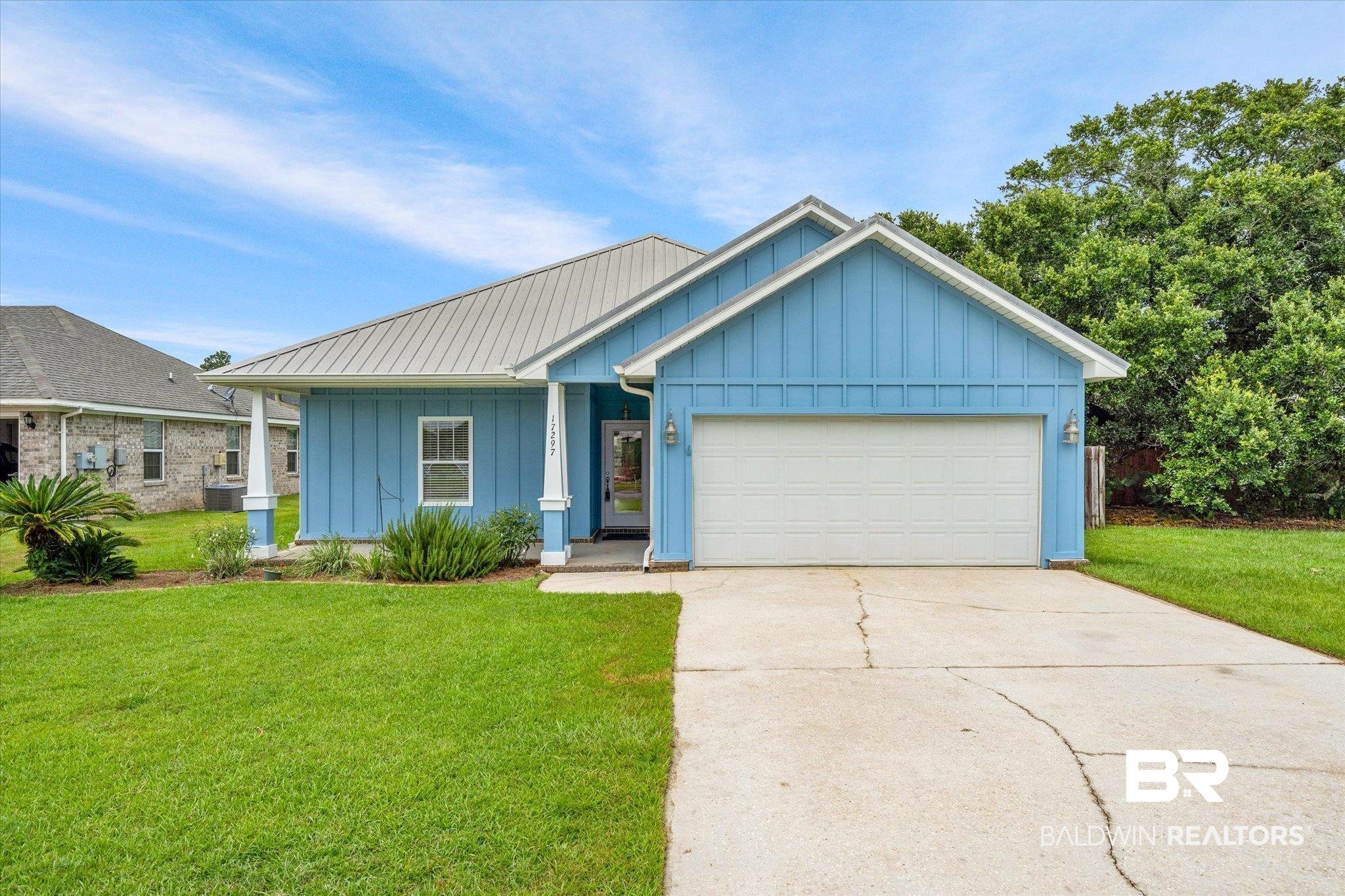 17297 Tallasee Boulevard Foley, AL 36535 - Photo 1 of 24 View of front facade with a garage and a front lawn