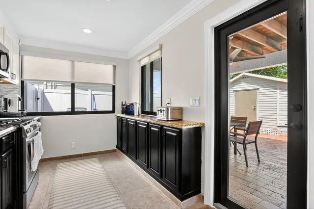 a view of a kitchen with furniture and a window