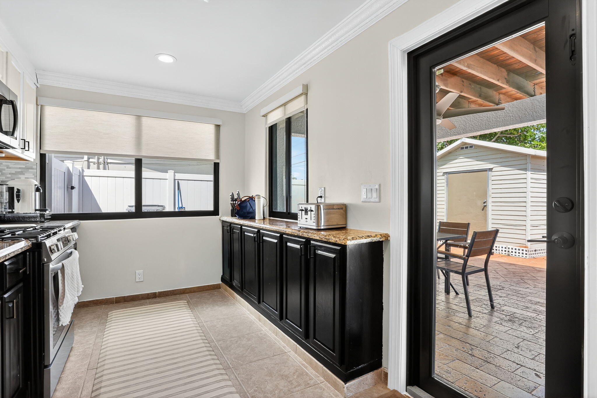 2840 Northeast 7th Terrace Pompano Beach, FL 33064 - Photo 12 of 42 a view of a kitchen with furniture and a window
