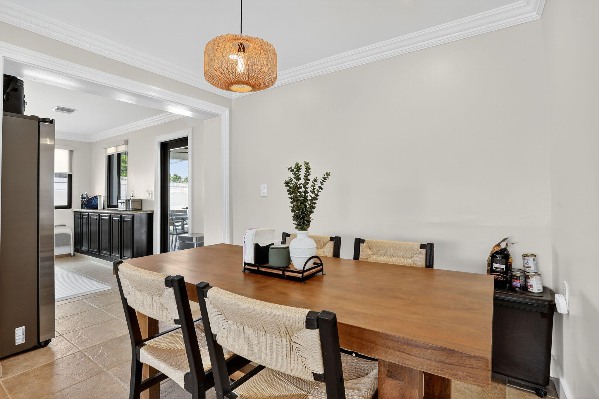 2840 Northeast 7th Terrace Pompano Beach, FL 33064 - Photo 13 of 42 a dining room with furniture and window