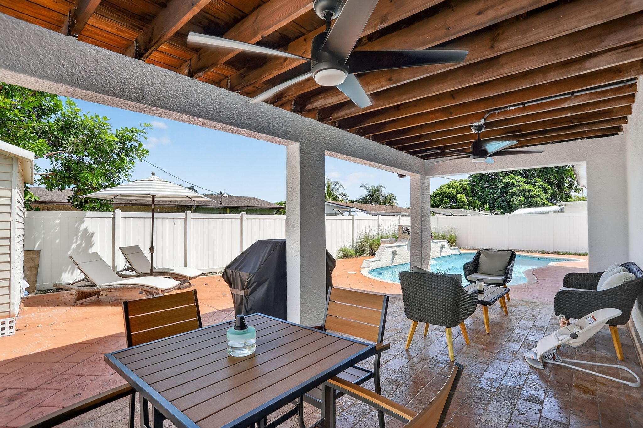 2840 Northeast 7th Terrace Pompano Beach, FL 33064 - Photo 24 of 42 a outdoor view with a sitting space