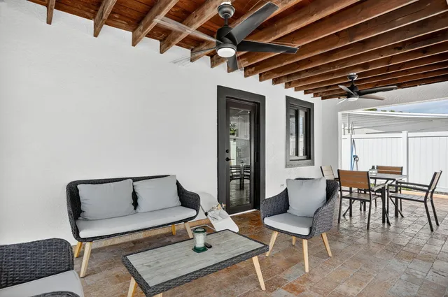 a living room with furniture and a window