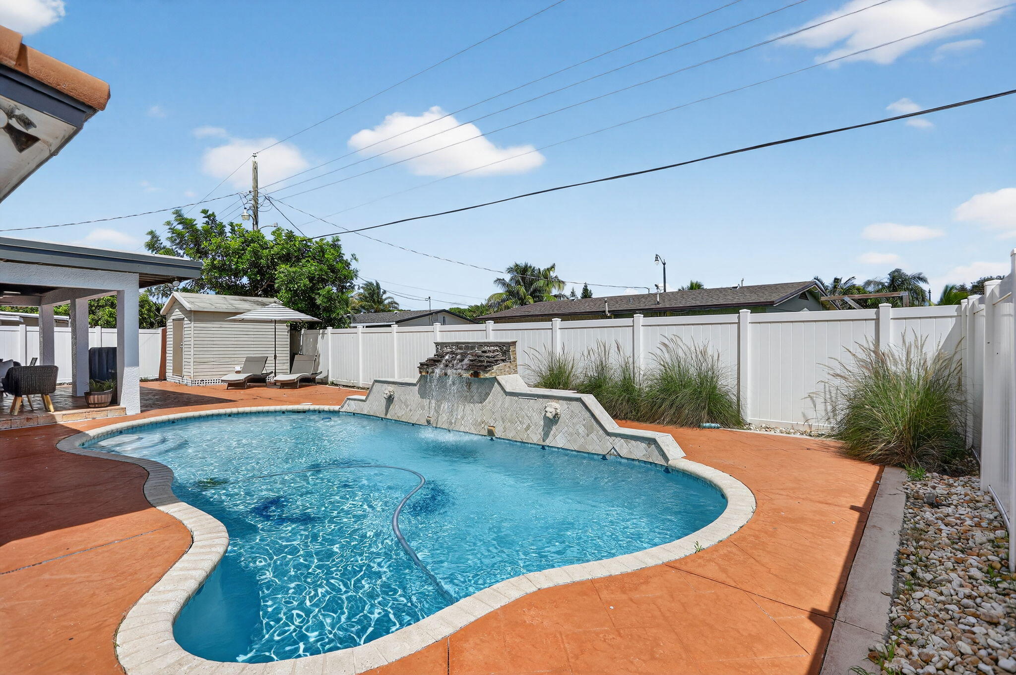 2840 Northeast 7th Terrace Pompano Beach, FL 33064 - Photo 28 of 42 a view of a swimming pool with a patio
