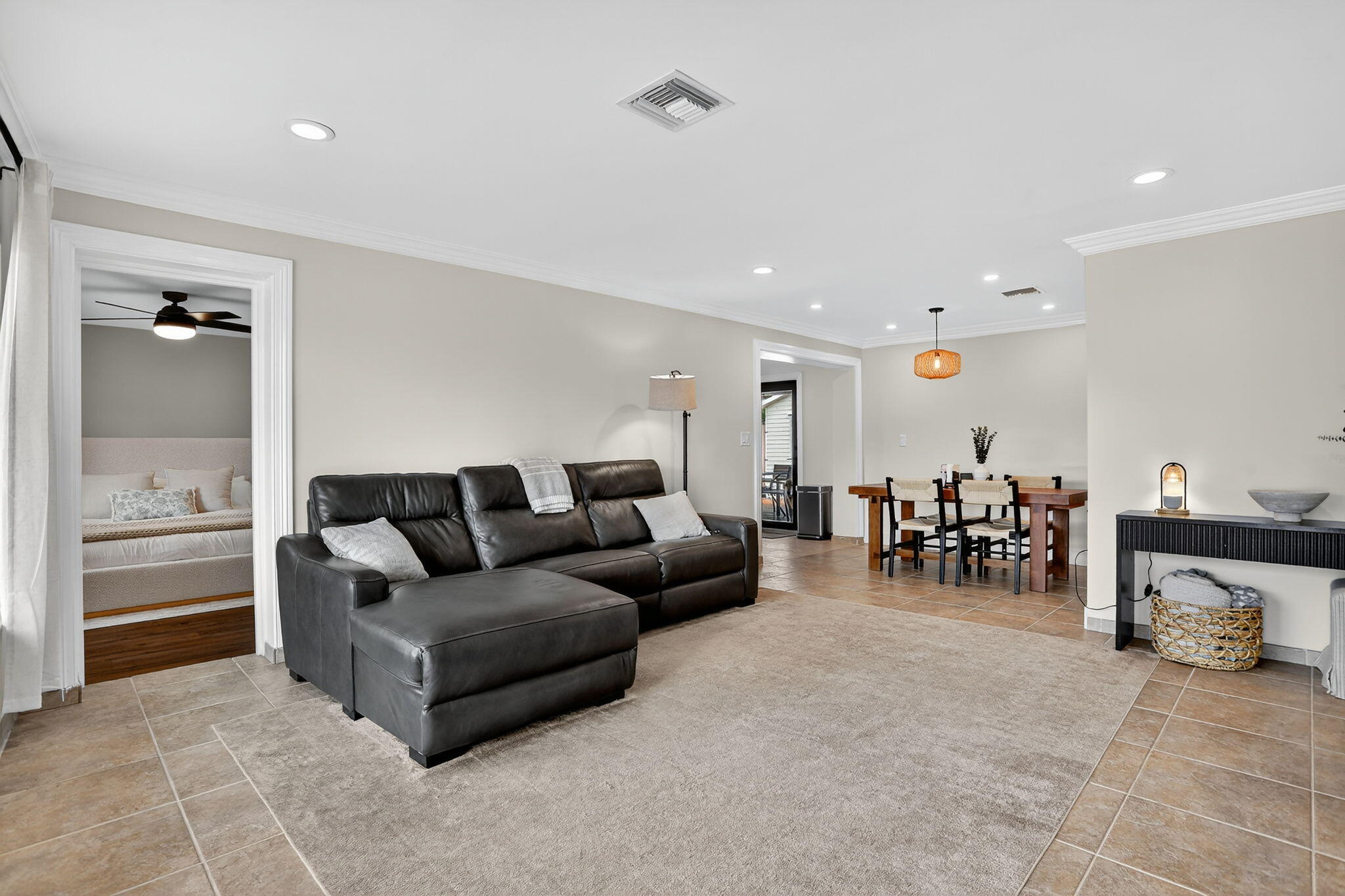2840 Northeast 7th Terrace Pompano Beach, FL 33064 - Photo 7 of 42 a living room with furniture and a dining table with wooden floor