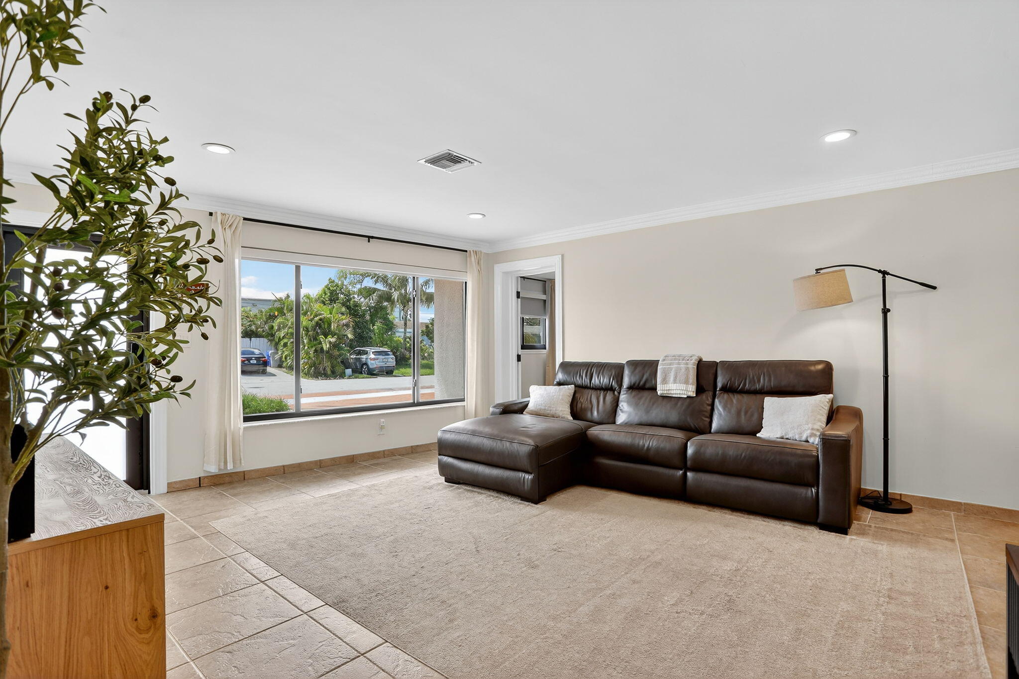 2840 Northeast 7th Terrace Pompano Beach, FL 33064 - Photo 8 of 42 a living room with furniture and a large window