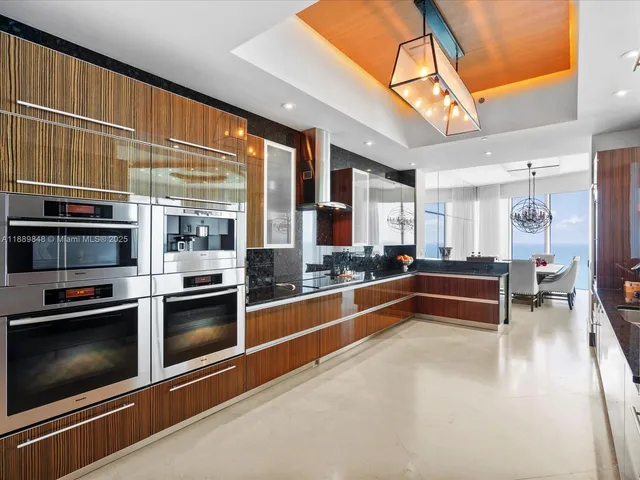 a bathroom with a sink a toilet a mirror and shower