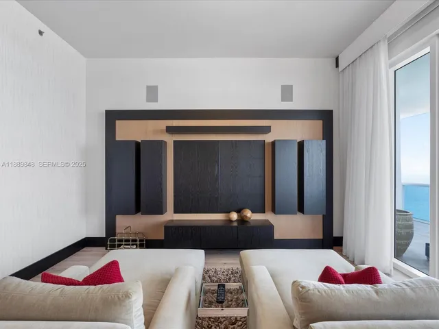 a bedroom with a large bed and a large window