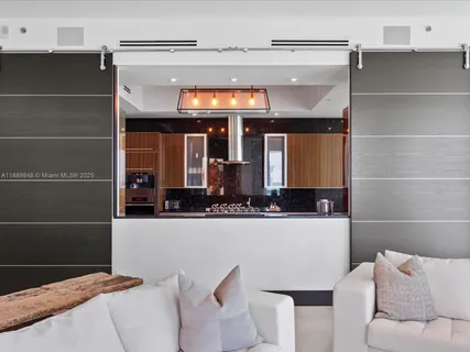 a bedroom with furniture and a large window