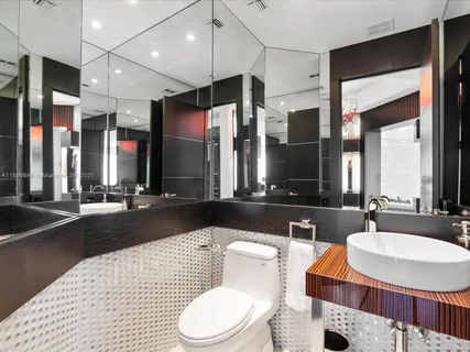 a bedroom with furniture and a large window