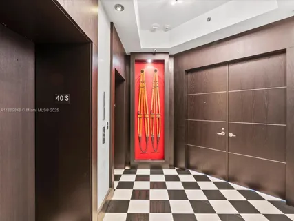 a bathroom with a black and white checkered floor