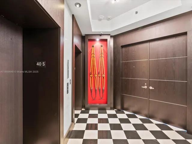 a bathroom with a black and white checkered floor