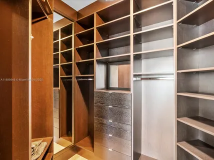 a kitchen with stainless steel appliances granite countertop a sink and a refrigerator