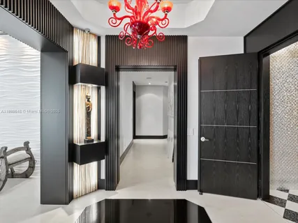 a living room with furniture and a large mirror