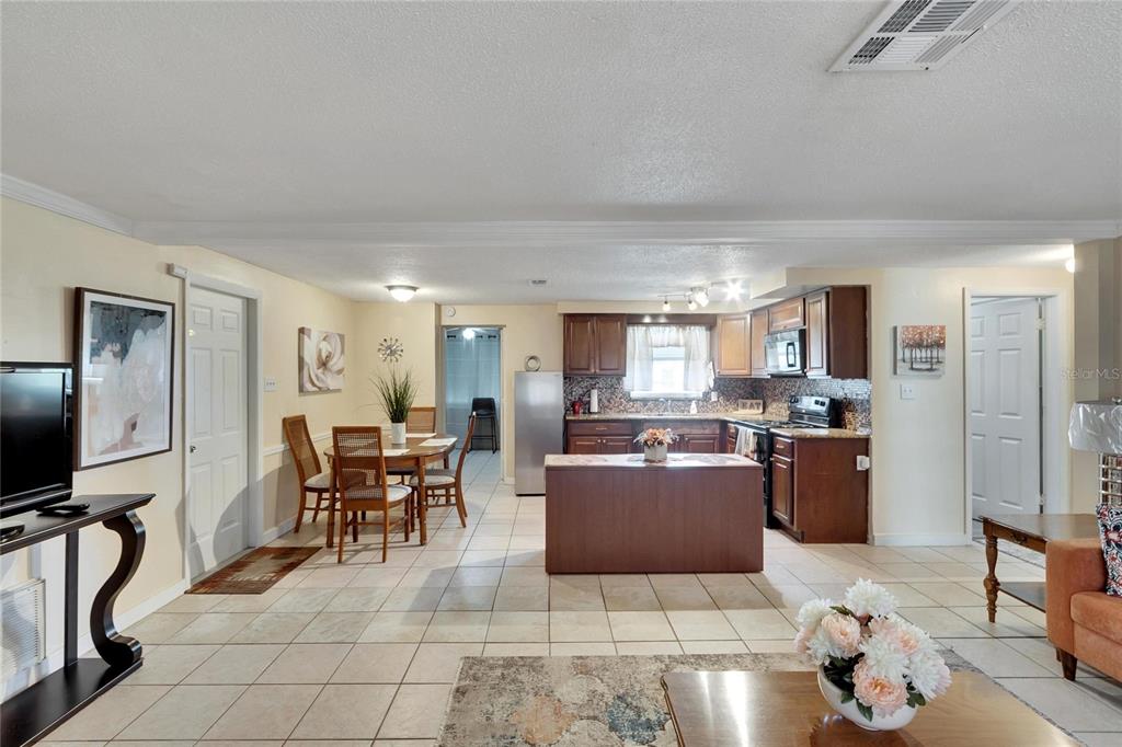 10801 Fillmore Avenue Port Richey, FL 34668 - Photo 13 of 29 a living room with furniture a flat screen tv and a window