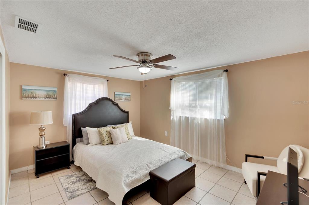 10801 Fillmore Avenue Port Richey, FL 34668 - Photo 25 of 29 a bedroom with a bed and window