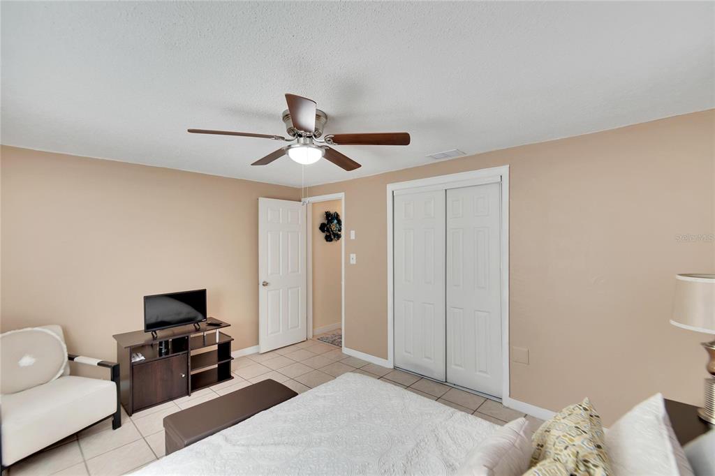10801 Fillmore Avenue Port Richey, FL 34668 - Photo 26 of 29 a living room with furniture and a flat screen tv