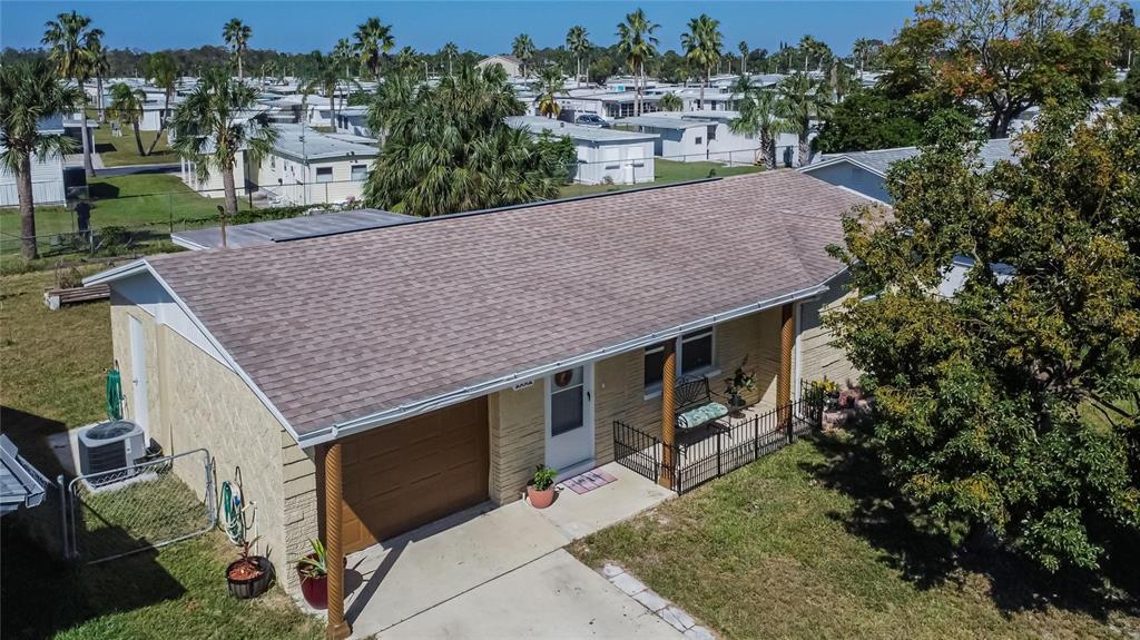 10801 Fillmore Avenue Port Richey, FL 34668 - Photo 5 of 29 an aerial view of a house with a yard table and chairs