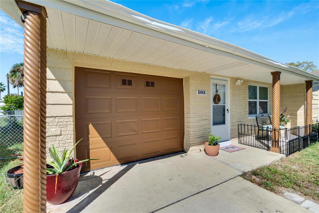 10801 Fillmore Avenue Port Richey, FL 34668 - Photo 6 of 29 a front view of a house with outdoor seating