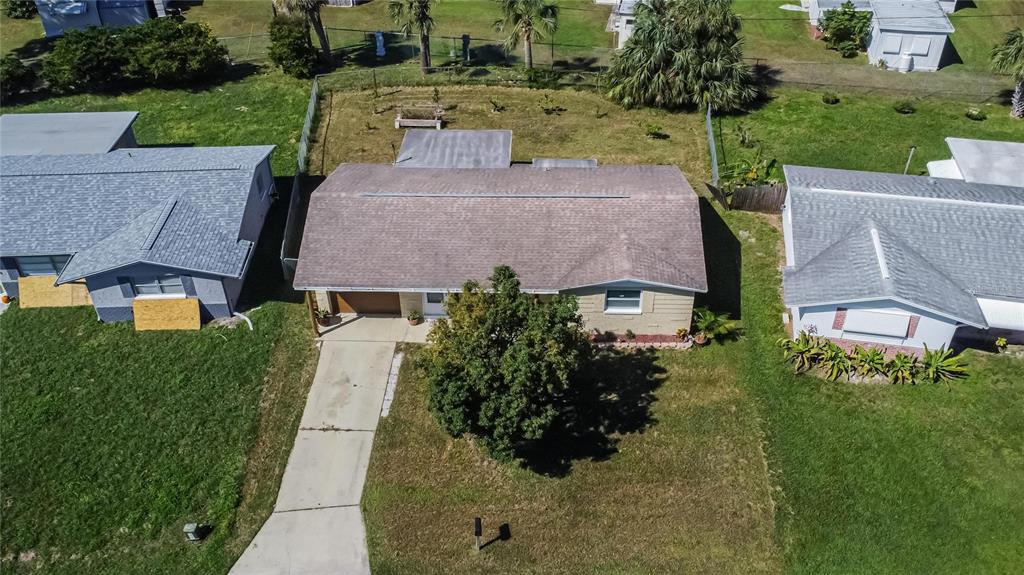 10801 Fillmore Avenue Port Richey, FL 34668 - Photo 10 of 29 an aerial view of multiple houses with a yard