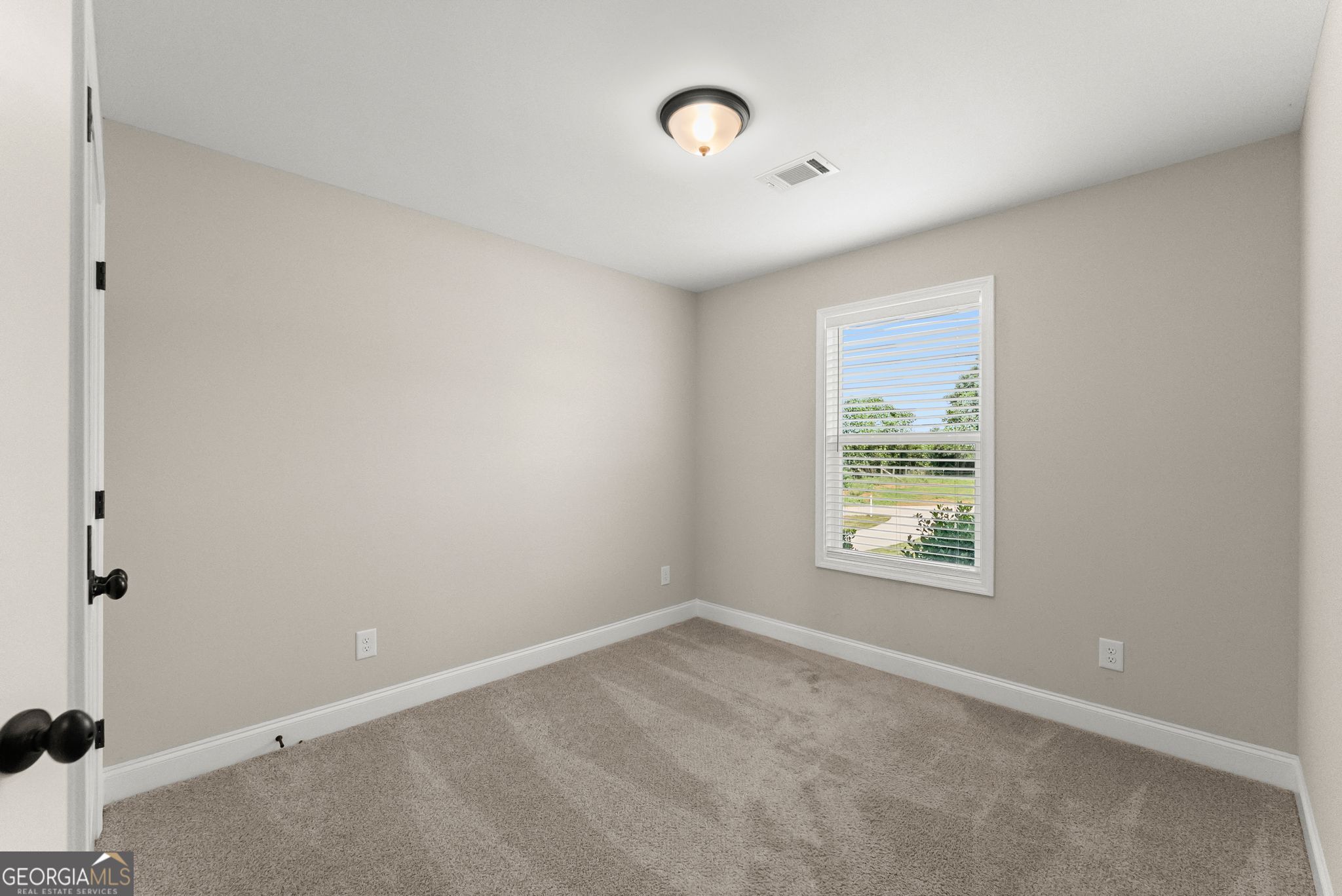 810 Anderson Thomas Road Martin, GA 30557 - Photo 18 of 40 an empty room with a window