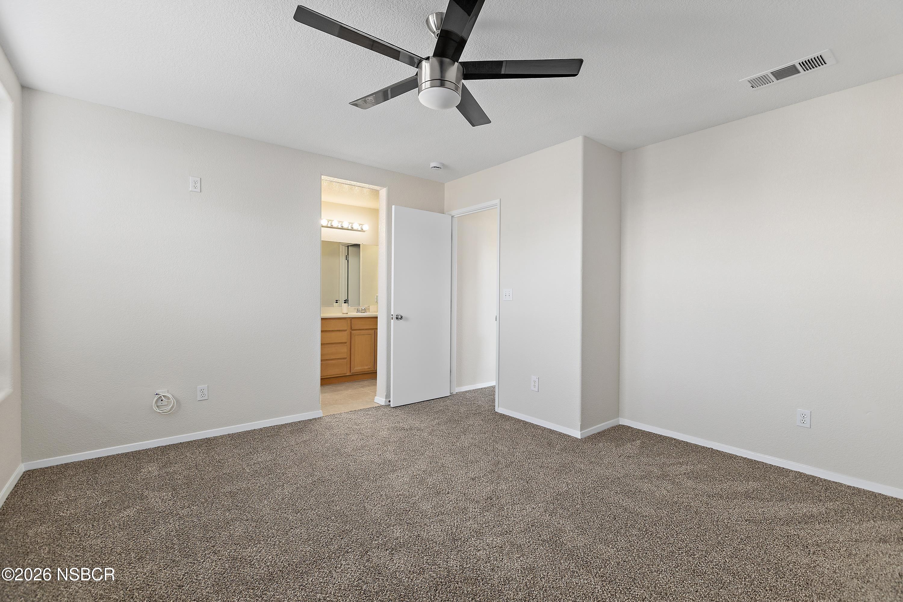 2020 Green Ridge Circle Lompoc, CA 93436 - Photo 11 of 20 a view of a livingroom with a ceiling fan and window